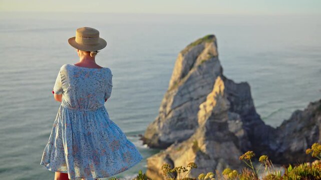 Woman Enjoying Scenic Atlantic Ocean View in Portugal