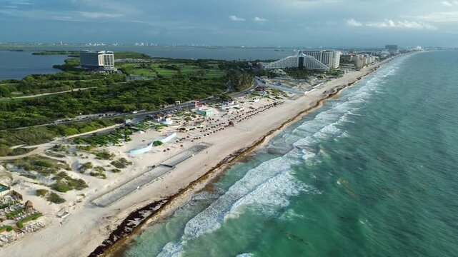 Beautiful view from the sky over Canc&uacute;n: beach, turtle nests, and Nichupt&eacute; Lagoon&mdash;an aerial drone view at sunrise.