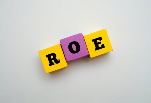 Colorful block with text ROE. ROE acronym for "RETURN ON EQUITY". Concept for financial, investment, and business growth