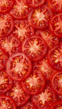 Fresh sliced tomatoes arranged in a seamless pattern, creating a vibrant natural food background with rich texture and healthy culinary appeal.