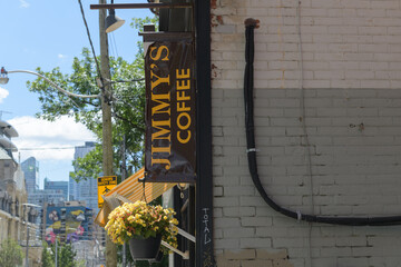 Fototapeta premium sign outside Jimmy's Coffee, a coffee shop, located at 166 McCaul St, Toronto