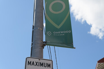 Fototapeta premium part detail of a BIA pole-mounted projecting banner at Oakwood Village (bounded by Eglinton Av W, Dufferin S, St Clair, Arlington Av/Vaughan Rd) Toronto