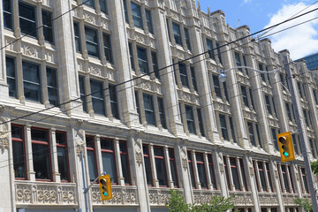Fototapeta premium exterior view of Methodist Book and Publishing Company (later the Ryerson Press and United Church Publishing House) and later CHUM-City Building, 299 Queen W, Toronto
