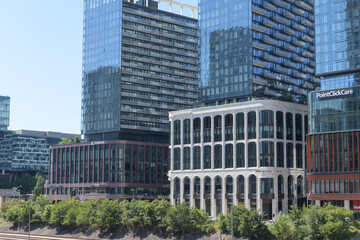 Fototapeta premium wide distant view of The Well (including sign of Sweat and Tonic, a fitness centre), terrace level, 486 Front St W, Toronto
