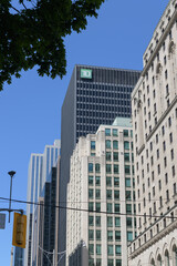 Fototapeta premium looking north on York St to buildings on the east side including TD Centre and corporate logo and Fairmont Royal York hotel, Toronto
