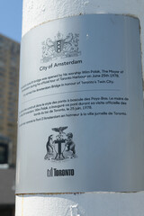 Fototapeta premium metal plaque with inscription for Amsterdam Bridge, a pedestrian / lift bridge at Harbourfront Centre, Toronto