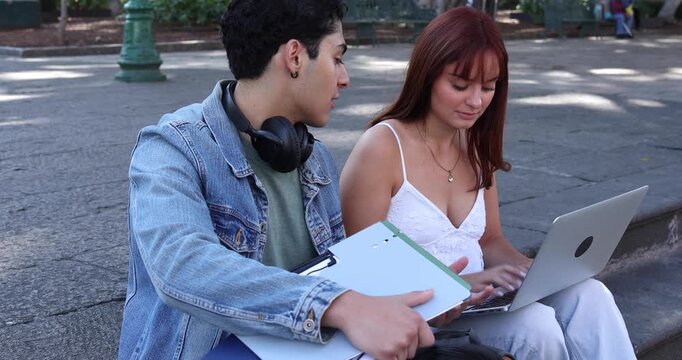 couple of latinos university students or hispanic friends in Mexico Latin America, Mexican young people studying outdoors