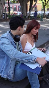 couple of latinos university students or hispanic friends in Mexico Latin America, Mexican young people studying outdoors