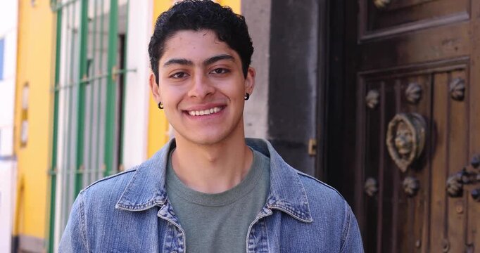 young latin man smiling outdoors in Mexico Latin America, hispanic and mexican male portrait