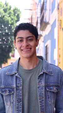 young latin man smiling outdoors in Mexico Latin America, hispanic and mexican male portrait