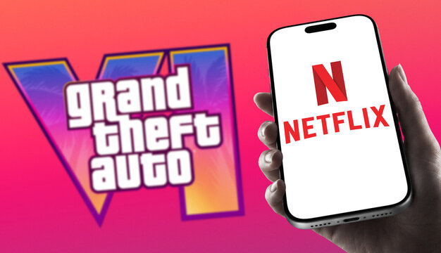Person Holding Apple iPhone Displaying Netflix App Logo with Grand Theft Auto VI GTA6 Rockstar Games Logo in Blurred Background