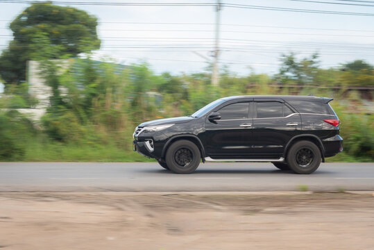 Nakhonsawan, Thailand - Oct, 2025: Toyota Fortuner a black car to speed running on the highway No.117, on October 24, 2025, at Nakhon Sawan, Thailand.