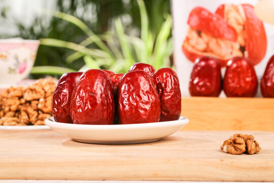 Red Dates Sandwiched with Walnuts Xinjiang Traditional Delicious Healthy Snack on Wooden Table