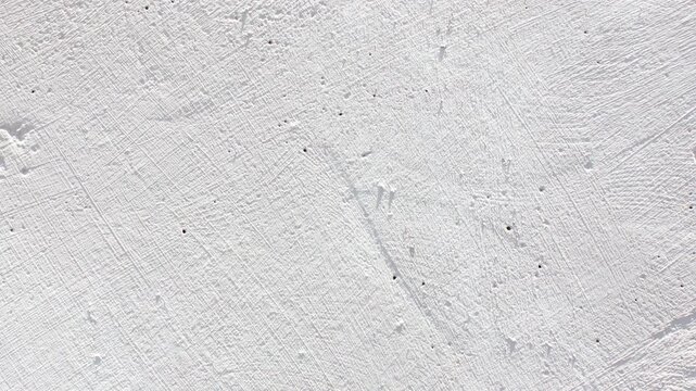 An authentic gray plastered wall of a building. A gray surface of the building with space to copy the image and insert text. A concrete wall,animation