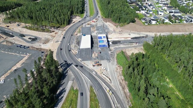 Aerial view of traffic on highway underpass construction site in Oulu, North Ostrobothnia, Finland.