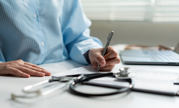 Healthcare doctor completing patient documentation and medical records in a modern clinic using administrative paperwork to support healthcare management, medical services and clinical operations.