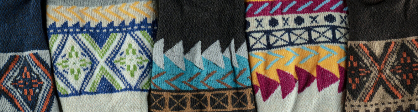 Colorful knitted wool fabric displaying geometric patterns
