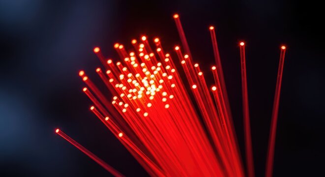 Close up macro shot of glowing fiber optic cables with vibrant red light beams representing high speed data transfer and digital connection, system, infrastructure, future