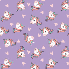 Cute unicorn heads with flowing manes and pink hearts scattered on a lavender background seamless pattern © Creativezone