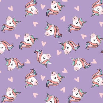 Cute unicorn heads with flowing manes and pink hearts scattered on a lavender background seamless pattern