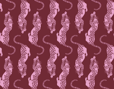 Pink leopards in a repeating pattern against a deep red background with a vintage aesthetic