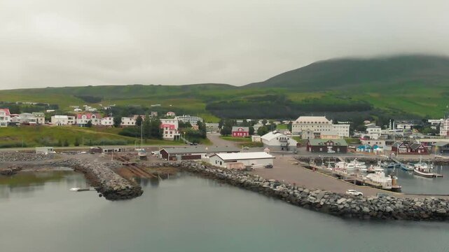 Drone panorama of Husavik port with Icelandic landscape and
