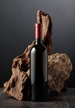 Red wine with old snag and a piece of granite rock.