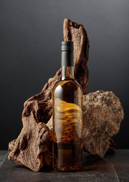White wine with old snag and a piece of granite rock.