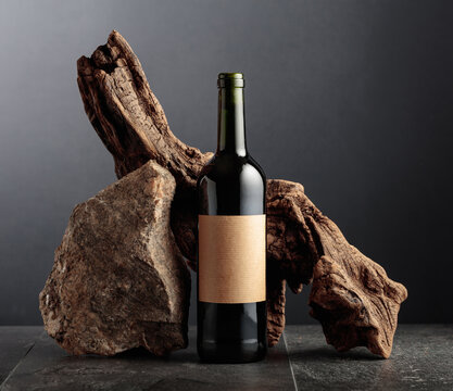 Red wine with old snag and a piece of granite rock.