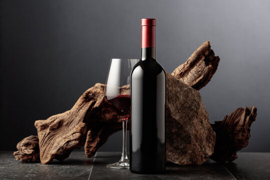 Red wine with old snag and a piece of granite rock.
