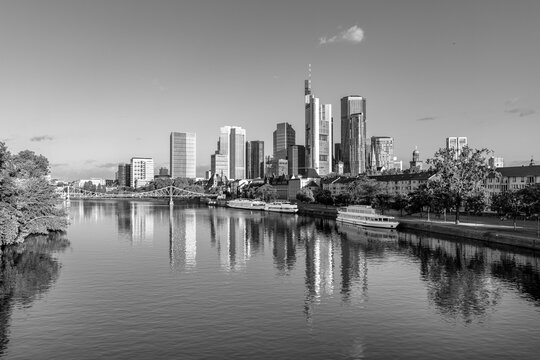 skyline of Frankfurt am Main in early morning light and reflection in river Main