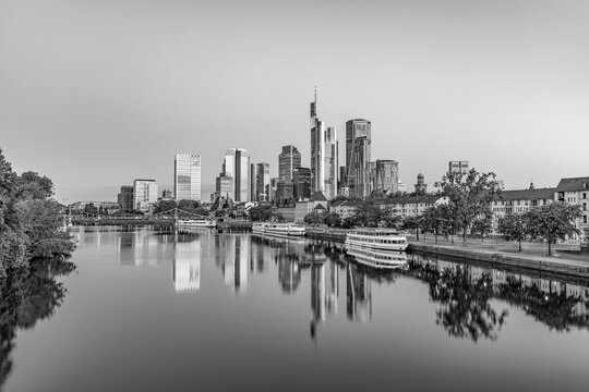 skyline of Frankfurt am Main in early morning light and reflection in river Main