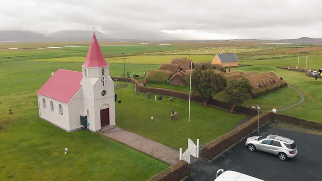 Drone view of Glaumbaer Village with iconic red church and