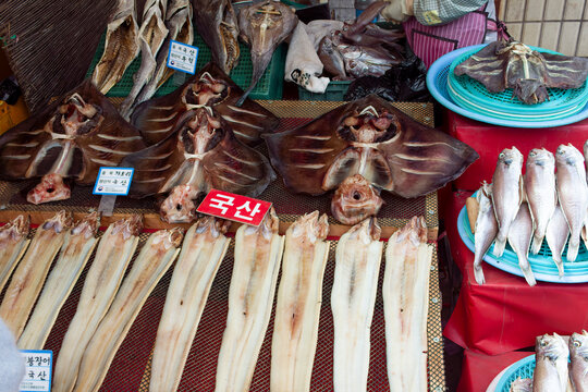 market stall in Busan displays an array of seafood like dried rays, Pollok and other fish.