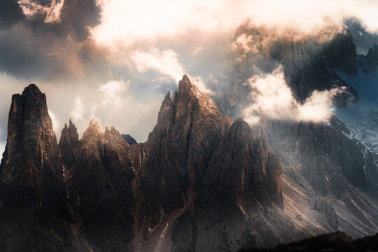 Dramatic Alpine Dolomites Peak Rising Through Storm Clouds Foggy at Italy