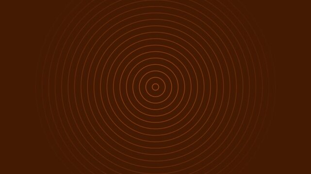 Abstract expanding concentric circles in brown tones resembling tree rings pattern