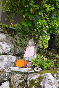 Stone Jizo Statue with Pink Apron along Kumano Kodo