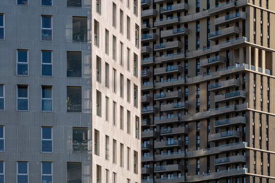 Seen across the district, facades and towers meet in contrast as apartments form layers of balconies, revealing density within Nordbahnviertel, Vienna, Austria.