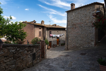 Fototapeta premium Picturesque stone alleyway and traditional architecture in Castiglione d'Orcia, Val d'Orcia, Italy