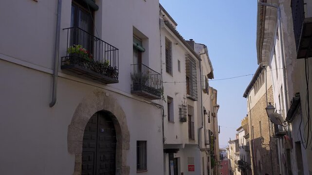 Traditional white houses with iron balconies along Calle San Pedro in old town Cuenca Spain