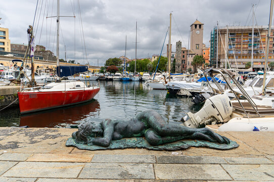 Savona, Liguria, Italy - June14, 2026. Bronze statue of the Sleeping Mermaid, located a short distance from the famous Torre del Brandale, the Torretta and the main premises of the port