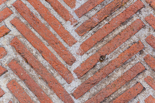 Antique brickwork.Vintage brick wall made of red and with weathered texture. Ideal for backgrounds, urban design, mockup