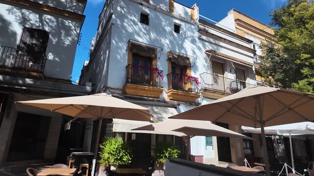 Balconies and cafe tables in historic plaza, Jerez de la Frontera, Spain