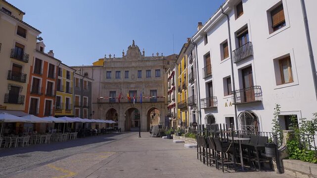 Wide view of Plaza Mayor with the arcaded city hall and surrounding buildings in Cuenca Spain