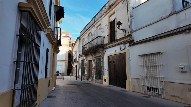 Quiet historic street and decaying mansion facade, Jerez de la Frontera, Spain