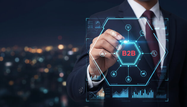 Man in suit drawing B2B business to business network diagram on digital screen.
