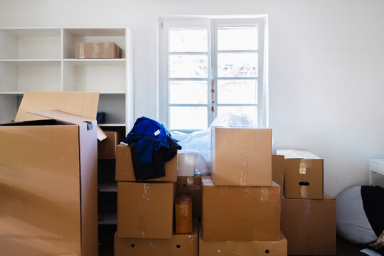 Packed Moving Boxes in Bright Empty Apartment