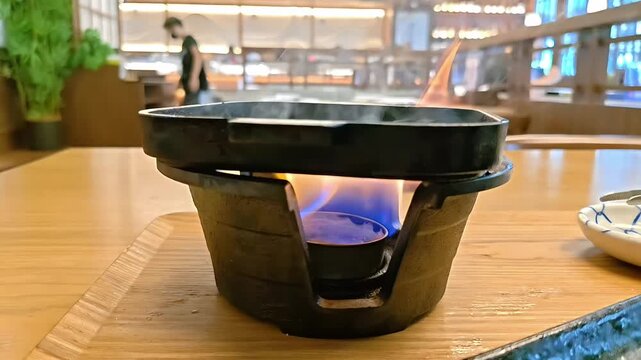 Small shichirin cast iron grill with cooking fire for barbecue, Japanese Food Preparation, Cast Iron Kitchen Equipment, Slow Motion
