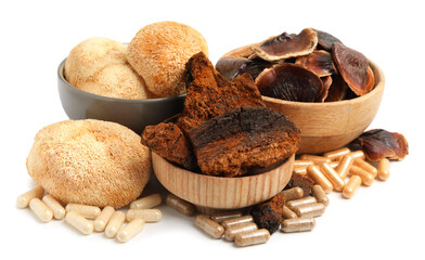 Different functional mushrooms and pills isolated on white © New Africa