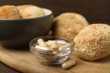 Functional mushrooms and pills on table, closeup © New Africa